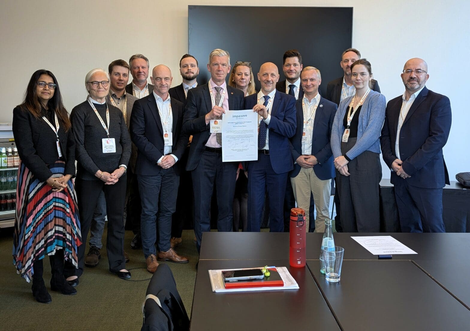 Group holding a newly signed charter of agreement for the IMEF.