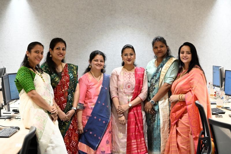Group of Indian women in traditional dress.