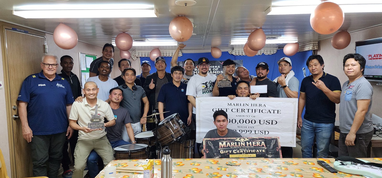 Group photo of the captain and the crew after jamming onboard 