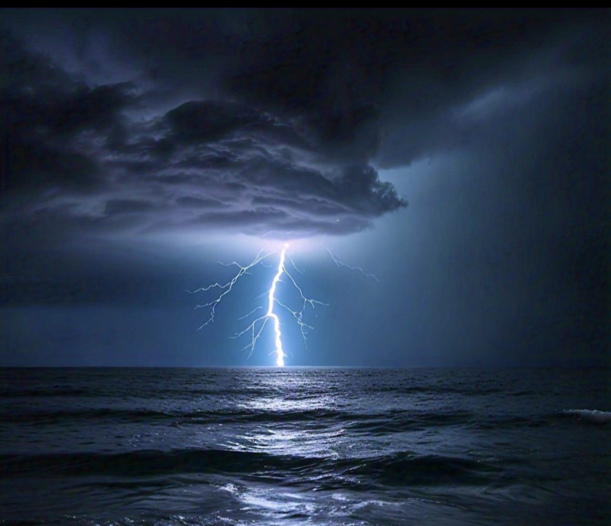 Lightening striking the sea at night