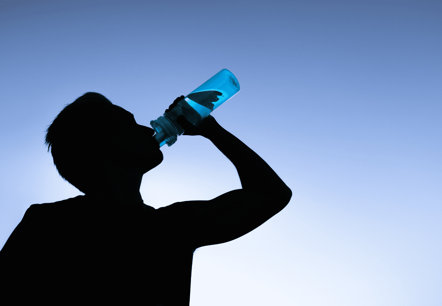 A person drinking water, hydrating himself. 