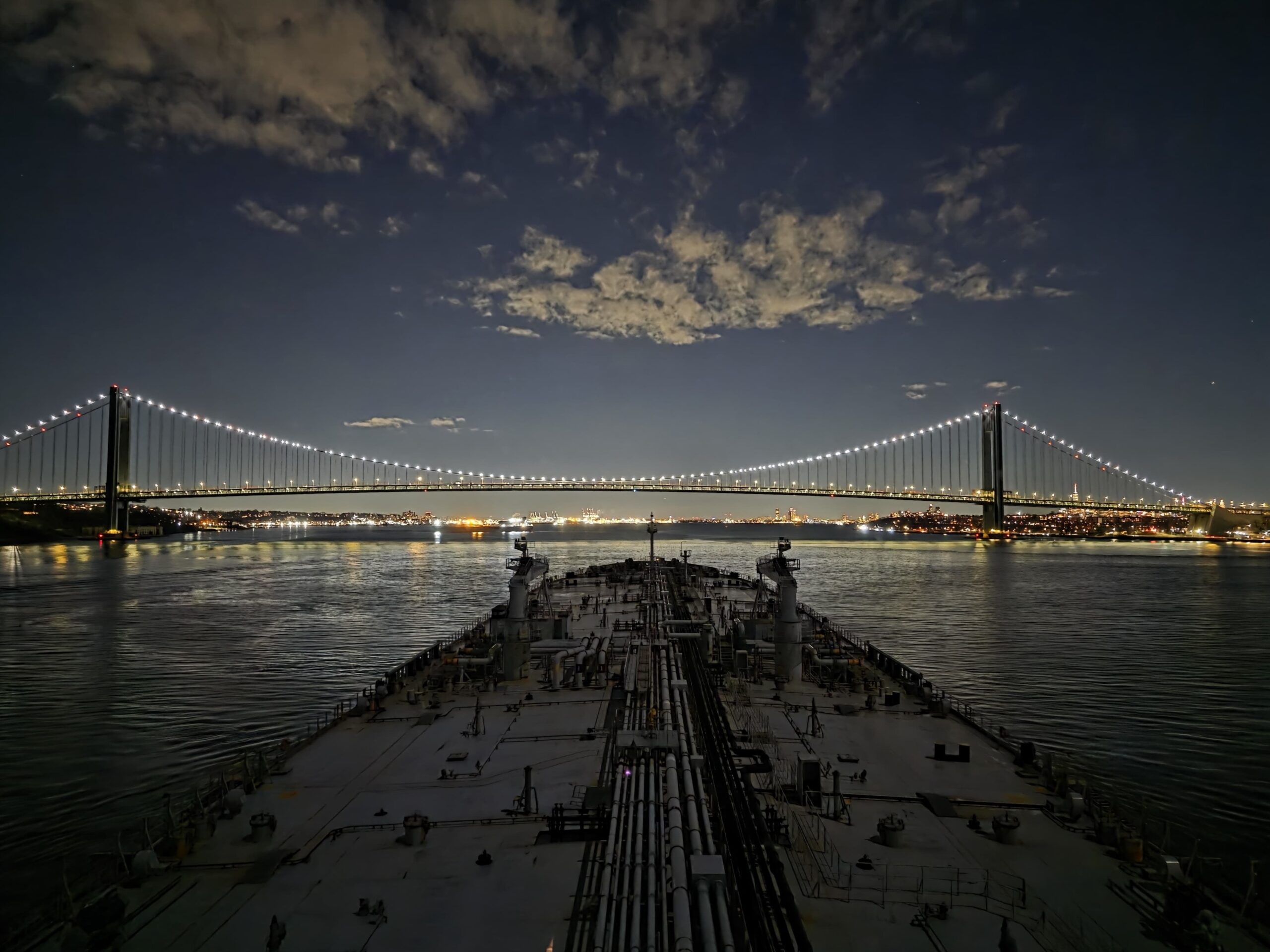 View of a bridge and city from a vessel.